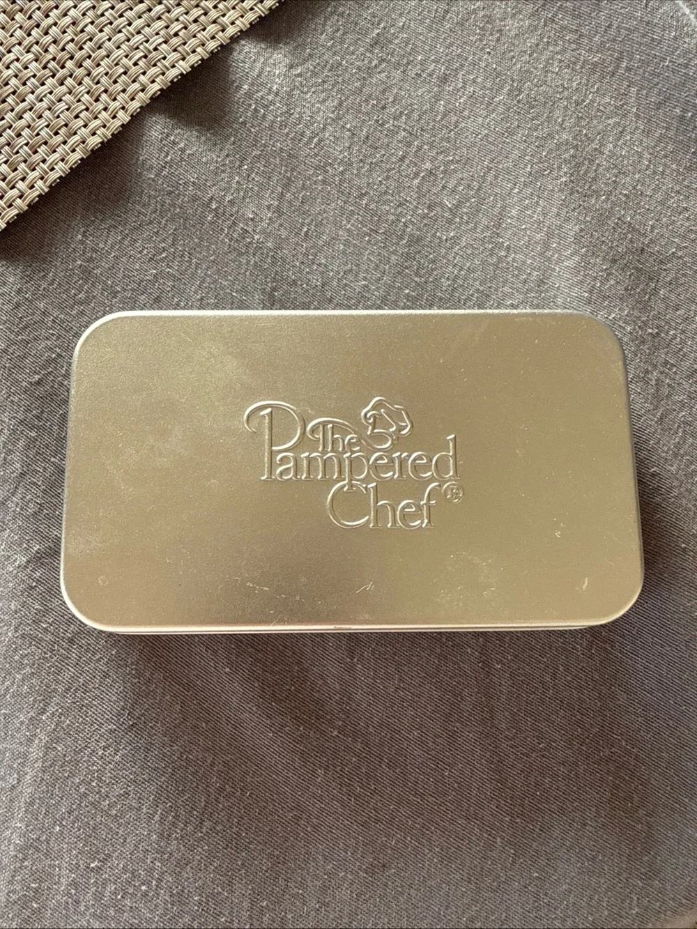 The Pampered Chef Silver Embossed Metal Tin with Cookie Cutters Set of 8